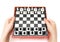 Mini compact chess with small figures in hands