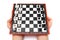 Mini compact chess with small figures in hands