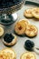 Mini crepes with black caviar and cream cheese, on a festive dish, mini pancakes