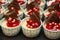 Mini cup cakes decorated cherry filling on top