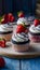 Mini cupcakes topped with chocolate and strawberries, complimentary download