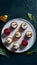 Mini desserts elegantly presented on pristine white plate, irresistible delights