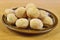 Mini doughnuts on a brown plate