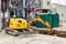 mini excavator digs a trench at a construction site. Laying of underground sewer pipes and communications during construction.