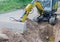 Mini excavator for road works for internet and power supply