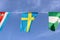 Mini fabric rail flag of Sweden it is consists of a yellow or gold Nordic Cross on a field of blue, hanging on the rope cloth.