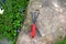 Mini garden rake on a stone used for landscape design. Hobby garden tool on a stone with copyspace.