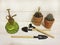 Mini gardening equipment with cactus in clay pots and vintage watering showers