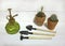 Mini gardening equipment with cactus in clay pots and vintage watering showers