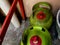 mini gas cylinder has a round shape with a green color and a red cap