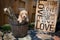 Mini Goldendoodle puppy with love sign