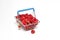 Mini grocery shopping basket with fresh raspberries on a white background. Food photo