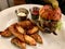 Mini Hamburger with Potato Wedges served with Ketchup and Mayonnaise.