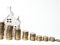 Mini house, stack of coins. Concept of Investment property. Mortgage concept