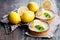 Mini lemon tarts on wooden table