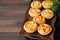 Mini meat pies from flaky dough on a vintage tray over wooden ba