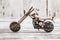 Mini Metal Model Motorcycle on White Wooden Background