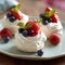Mini Pavlova cake with raspberry and blueberry. Mini-Pavlova dessert