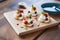 mini pavlovas with whipped cream on a wooden board