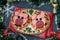 Mini pizza with sausage and cheese in the shape of a cute pigs - a symbol of 2019