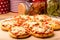 Mini pizzas on wooden board.