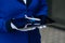 The mini plane`s layout is in the hands of a flight attendant in white gloves closeup. The concept of using a toy plane for an