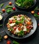 Mini potato gnocchi tricolour with tomato, spinach, Seasonal salad leaves and parmesan cheese