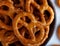 Mini pretzels with salt in a ceramic bowl close-up