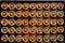 mini pumpkin pies arranged in rows on a baking tray