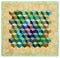 Mini quilt sewn from diamonds and has view three-dimensional