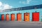 Mini rental storage units with vibrant colors, warehouse exterior