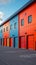 Mini rental storage units with vibrant colors, warehouse exterior