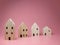 Mini residential craft house on a pink background