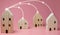 Mini residential craft house on a pink background
