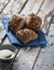 Mini rustic bread with flaxseed on a blue linen