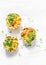 Mini savory pie with chicken, leek, cheese on light background, top view. Delicious appetizer, snack, breakfast