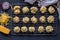 Mini savoury cheese and onion muffins out of oven on cake grid - overhead view of cheesy appetizer biscuit