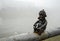 Mini sculpture of Celt on the embankment of the river Latoritsa in rainy weather