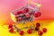 Mini shoppingcart with red ripe cherries