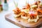 mini sloppy joe appetizers on a serving tray