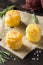 Mini stacks of potato gratin with cheese and rosemary, beautiful appetizer