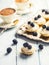 Mini tartlets with blackberries whipped cream and coffee