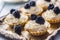 Mini tartlets with blackberries whipped cream and coffee