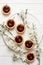 Mini tarts with chocolate and cherries decorated cherry blossom