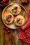 Mini Tarts with fresh cherries and vanilla custard and caramel, delicious dessert on a wooden table