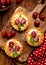 Mini Tarts with fresh cherries and vanilla custard and caramel, delicious dessert on a wooden table