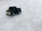 Mini toy maket black CUV car in the snow winter background cold weather problems