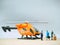 Mini toy at table with blurred background. Helicopter transportation concept design.