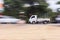 Mini truck panning camera in road