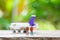 Miniature 2 people standing travel planner with Plane model as background travel concept with copy space